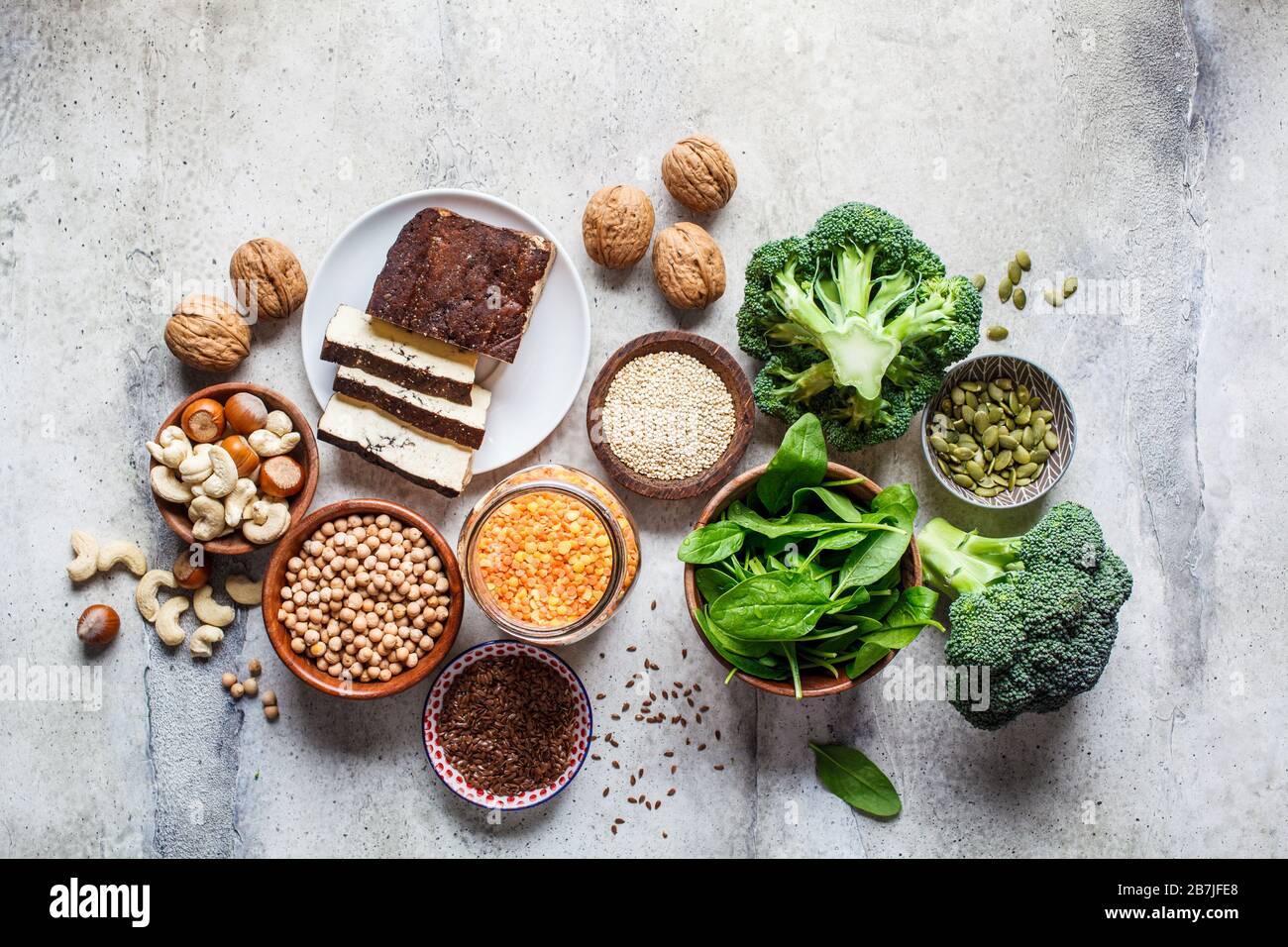 Vegan sources of protein background, top view. Tofu, chickpeas, lentils