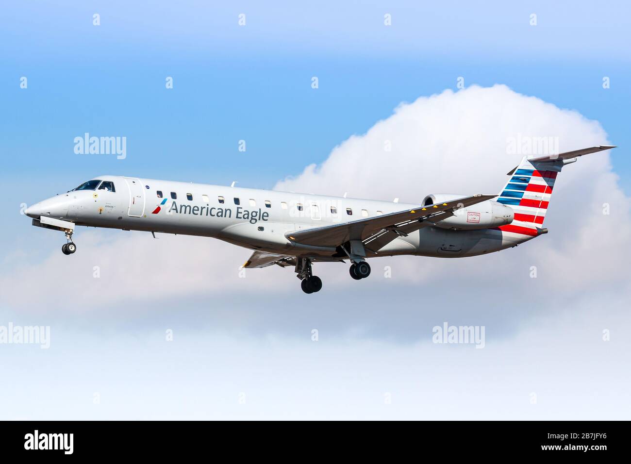 New York, USA - February 29, 2020: American Eagle Embraer ERJ-145 airplane at New York John F. Kennedy airport (JFK) in the USA. Embraer is an aircraf Stock Photo