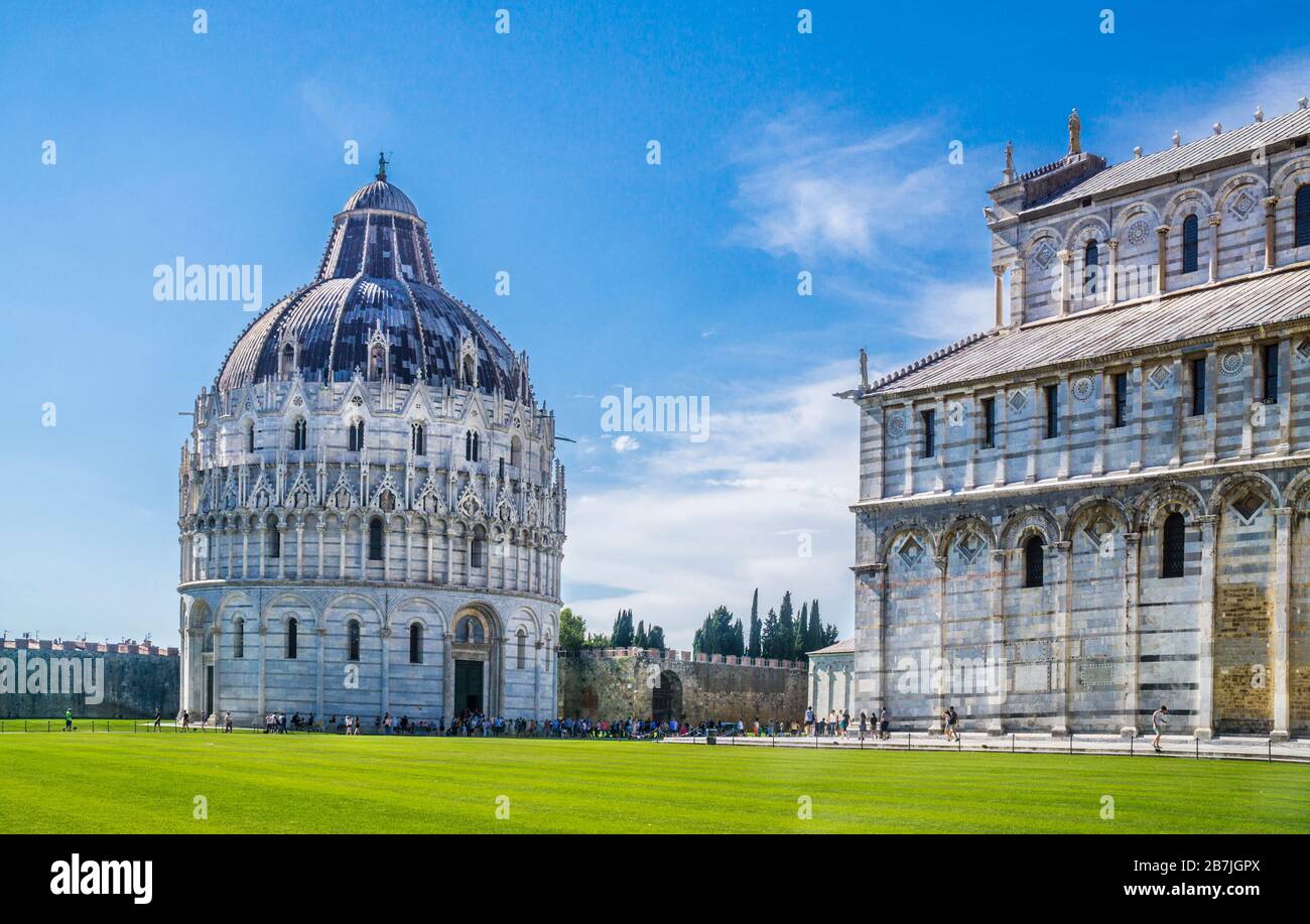 the Pisa Baptistery of St. John in the Piazza dei Miracoli, near the Duomo di Pisa and the cathedral's free-standing campanile, the famous Leaning Tow Stock Photo