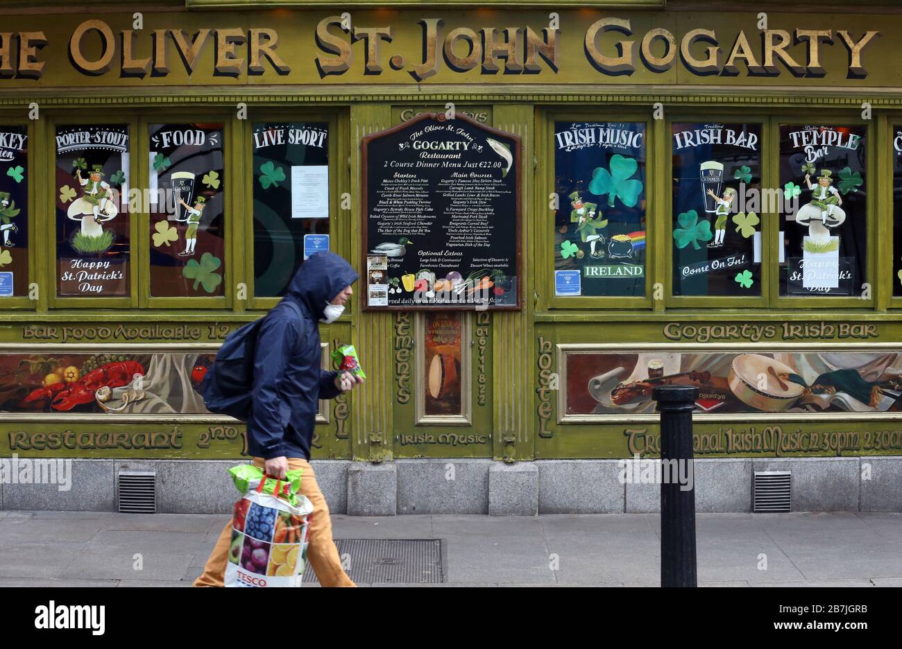 Dublin, Ireland. 16th Mar 2020. Covid-19 Pandemic (Coronavirus) Ireland.  Effects On Alcohol Industry. People outside The Oliver Saint John Gogarty pub in Dublin as all pubs in Temple Bar and the country have closed down with immediate effect. The action was taken as a result of widespread disregard in the area of the advise given by the governments health advisory committee to stem the advance of the Covid-19 virus into the community. Photo: Leah Farrell/RollingNews.ie Credit: RollingNews.ie/Alamy Live News Stock Photo