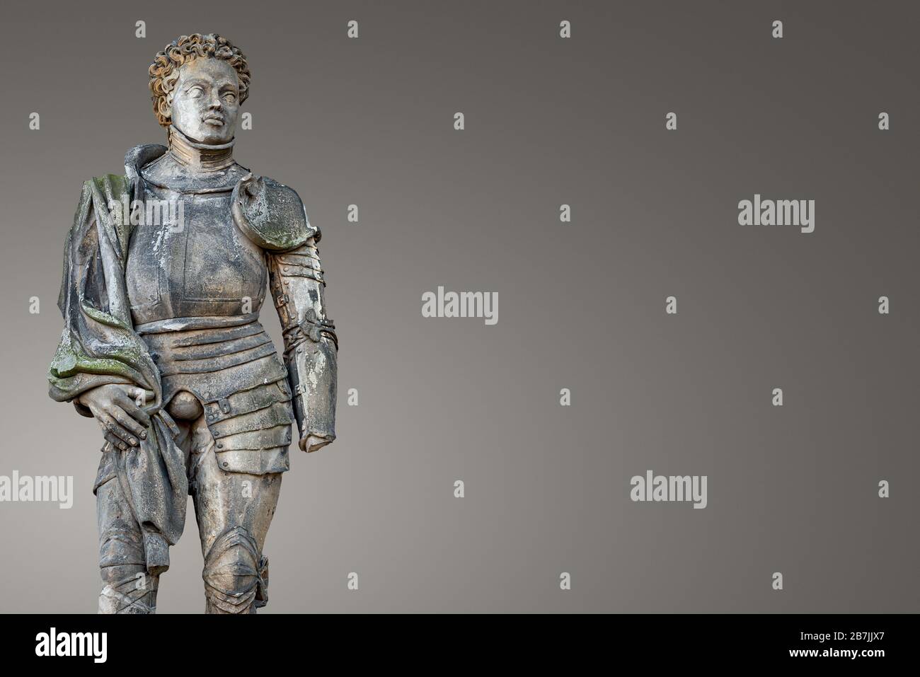 Banner with isolated ancient statue portrait of Saint Maurice (black Knight) as gatekeeper in Magdeburg Cathedral as Roman soldier from Thebes of 13 c Stock Photo