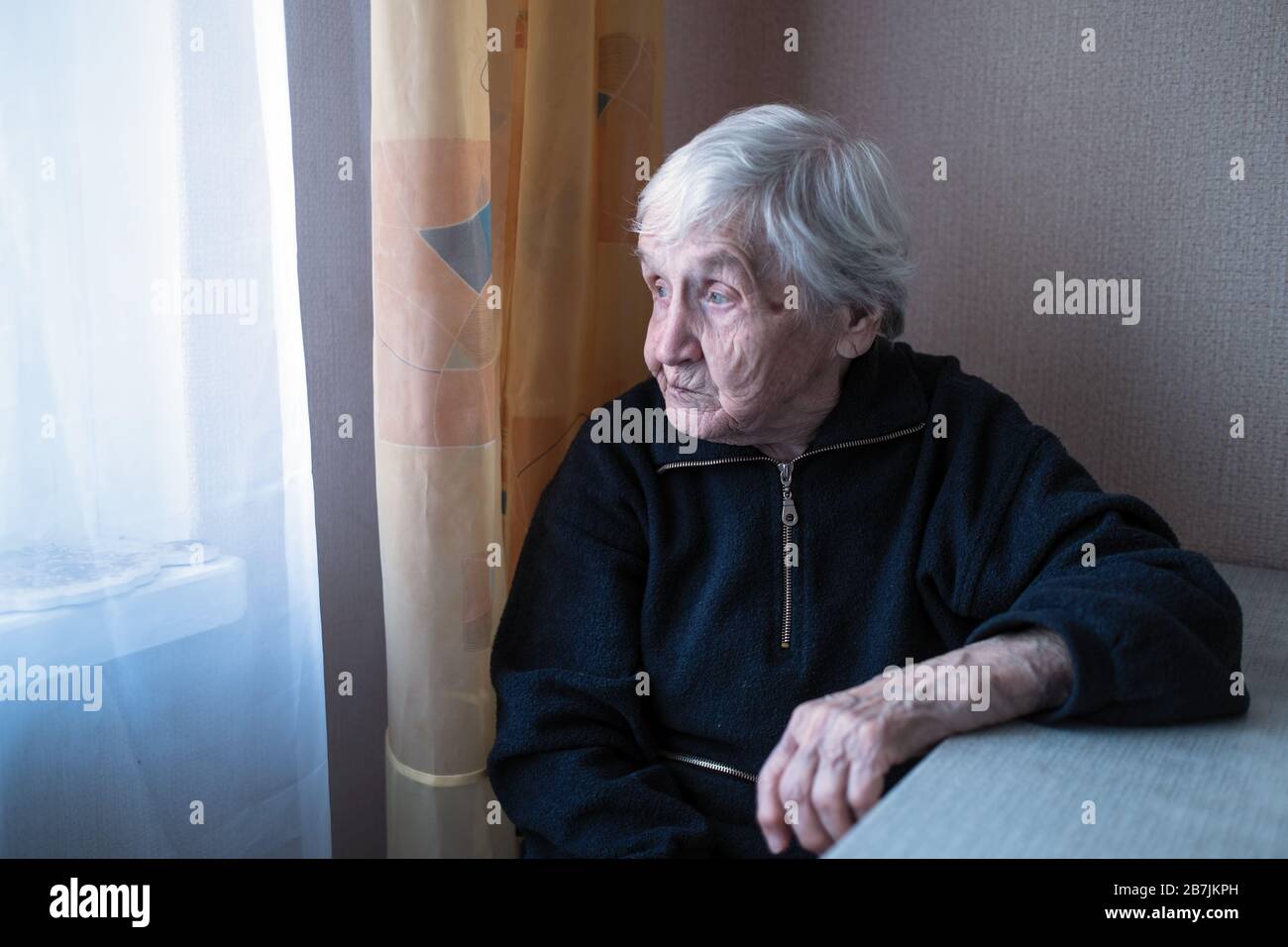 Lonely old woman hi-res stock photography and images - Alamy