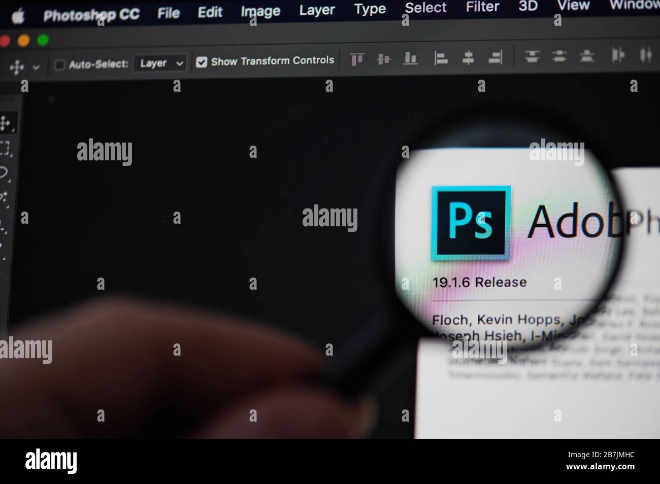 New-York , USA - March 13, 2020: Adobe photoshop application icon view throw magnifier  close up Stock Photo