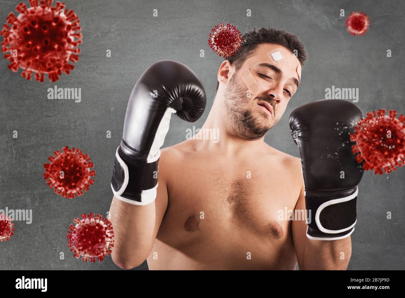 Man fights like a boxer. Concept of viruses and bacteria attack Stock Photo