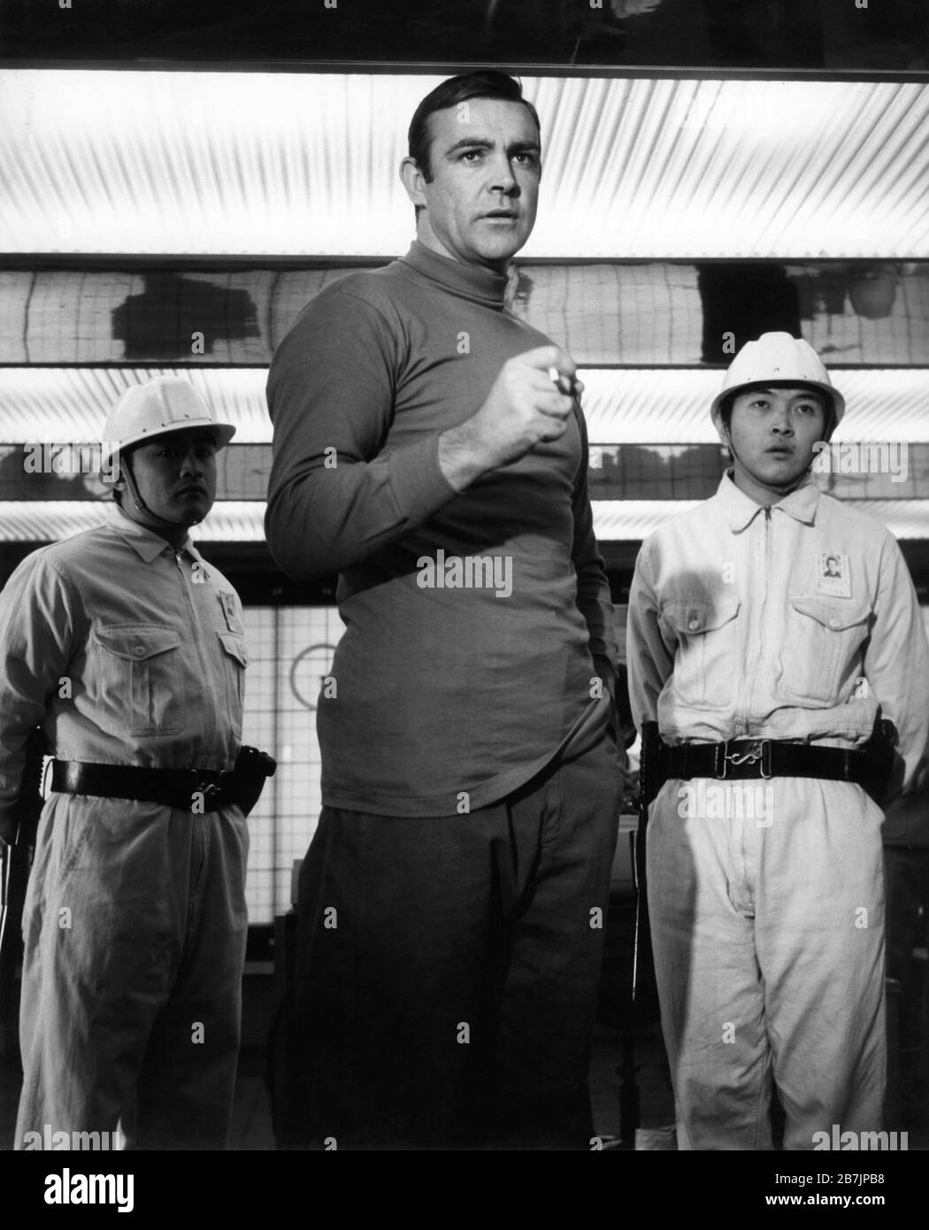 Sean Connery As James Bond 007 With Exploding Cigarette Next To Volcano Guards In You Only Live Twice 1967 Director Lewis Gilbert Novel Ian Fleming Screenplay Roald Dahl Producers Harry Saltzman And