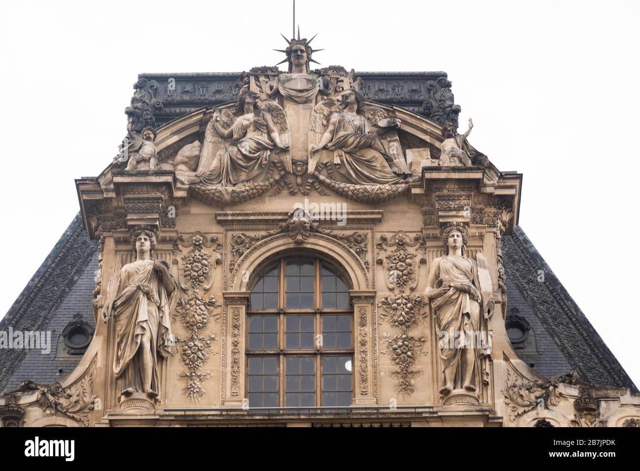 Louvre courtyard buildings roof sculptures Stock Photo