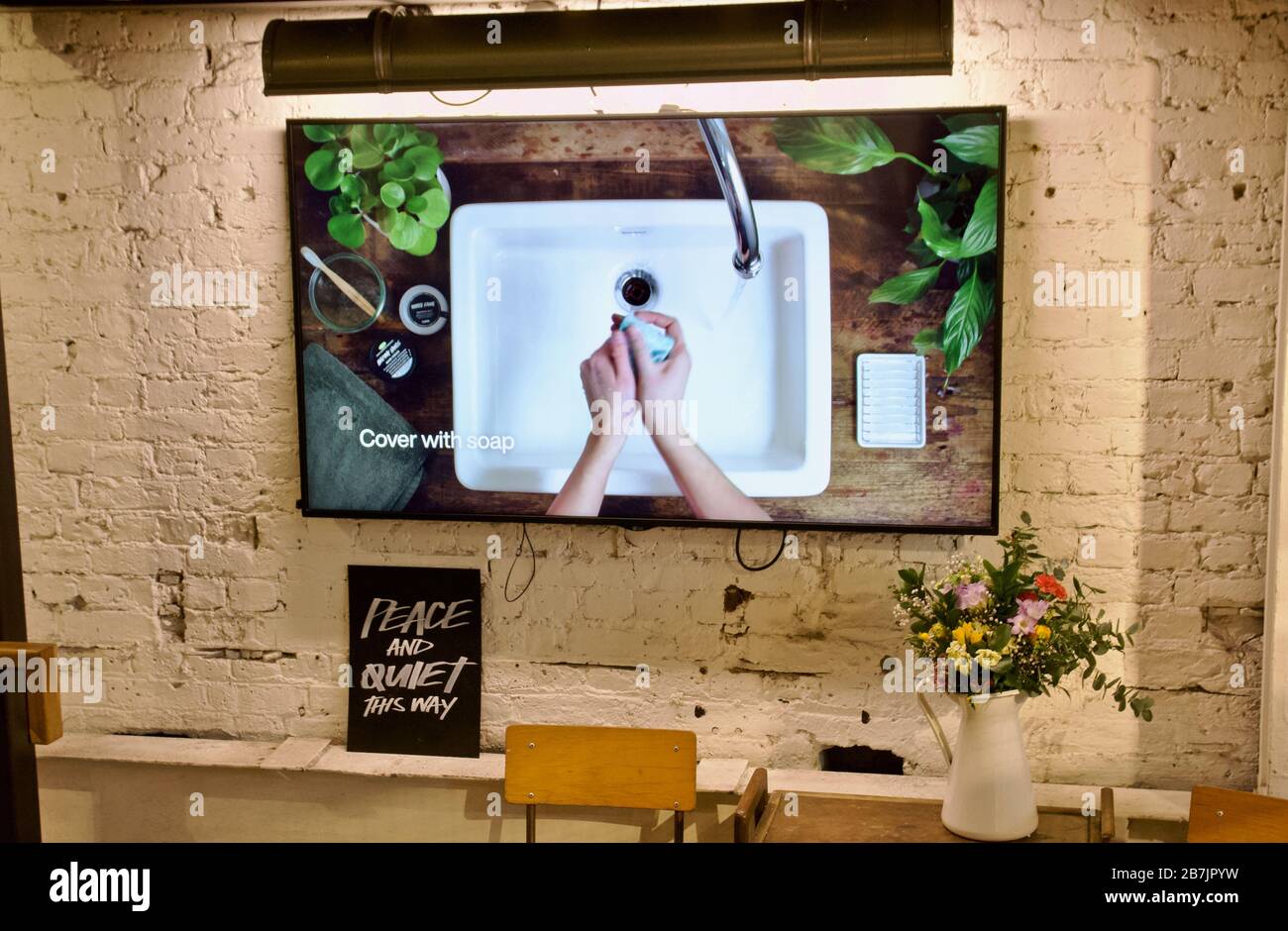 A hand washing guide video inside a UK lush store, promoting public health during Coronavirus Stock Photo