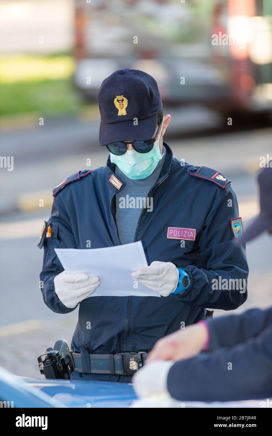 Ferrara, Italy. March 16, 2020. Police control people wearing gloves and  sanitary masks outside the train station during the coronavirus emergency  in Ferrara, Italy. Credit: Filippo Rubin / Alamy Live News Stock Photo -  Alamy