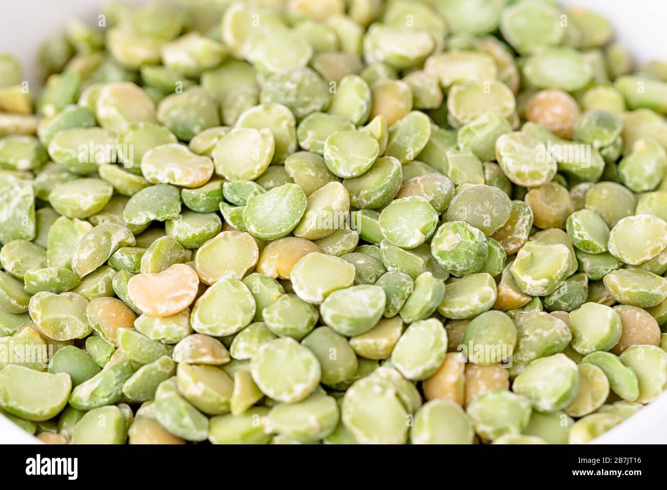 Dry split light green peas texture background Stock Photo
