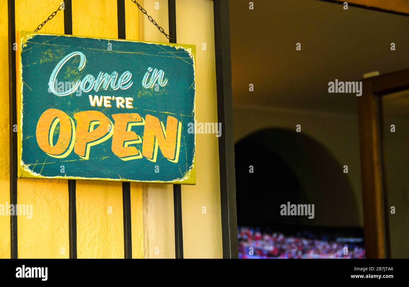 'We're open' sign outside a cafe bar in Europe Stock Photo