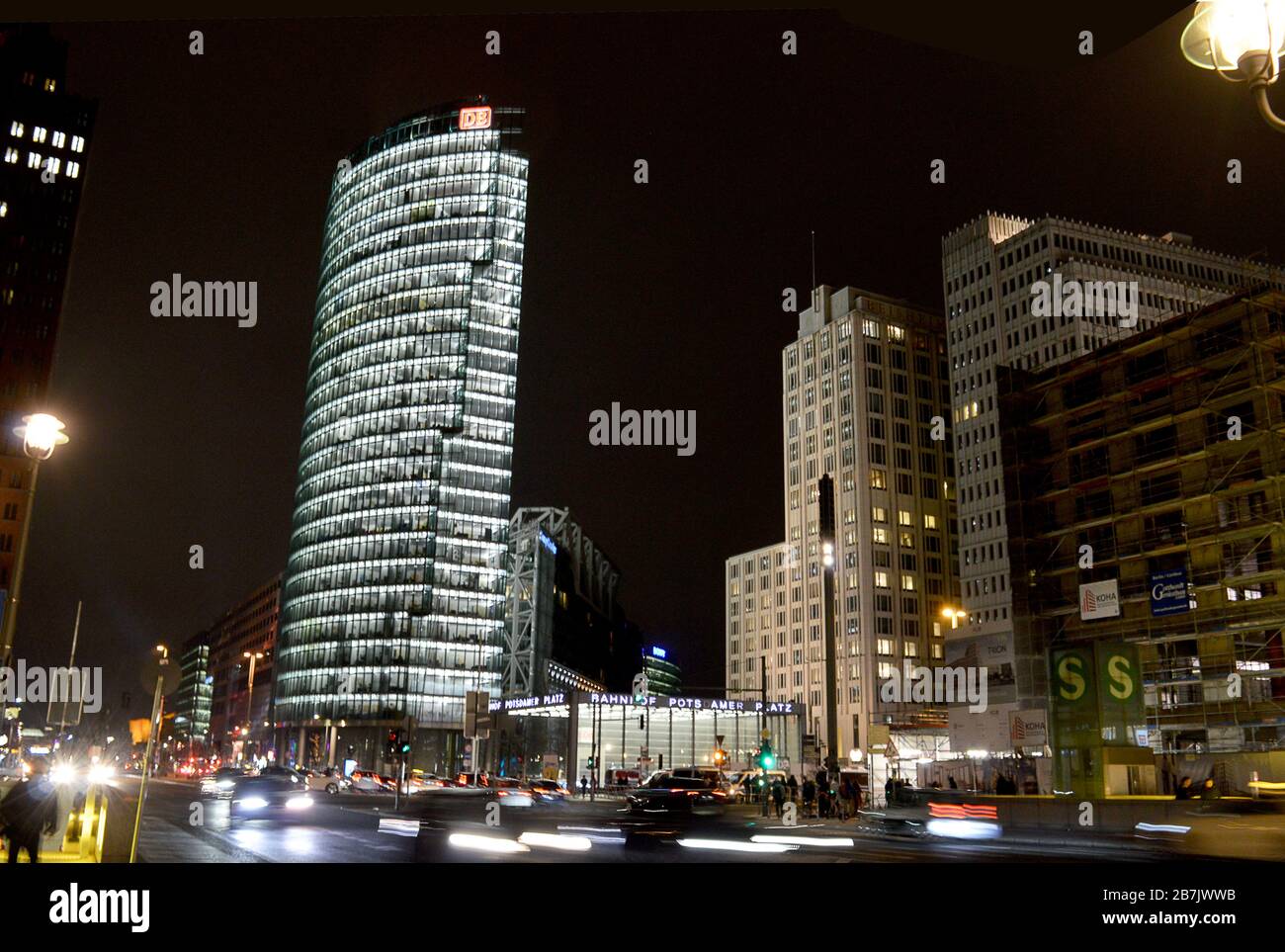 18 JANUARY 2020: Potsdamer Platz at night with the German Railways headquarters, the BahnTower, station and the Beisheim Building housing the Ritz-Car Stock Photo