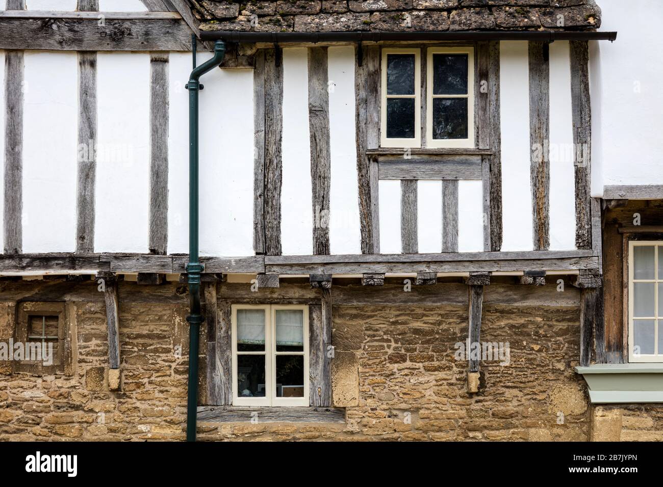 Medieval half-timbered building in Cotswold village of Lacock, Wiltshire, England, UK Stock Photo