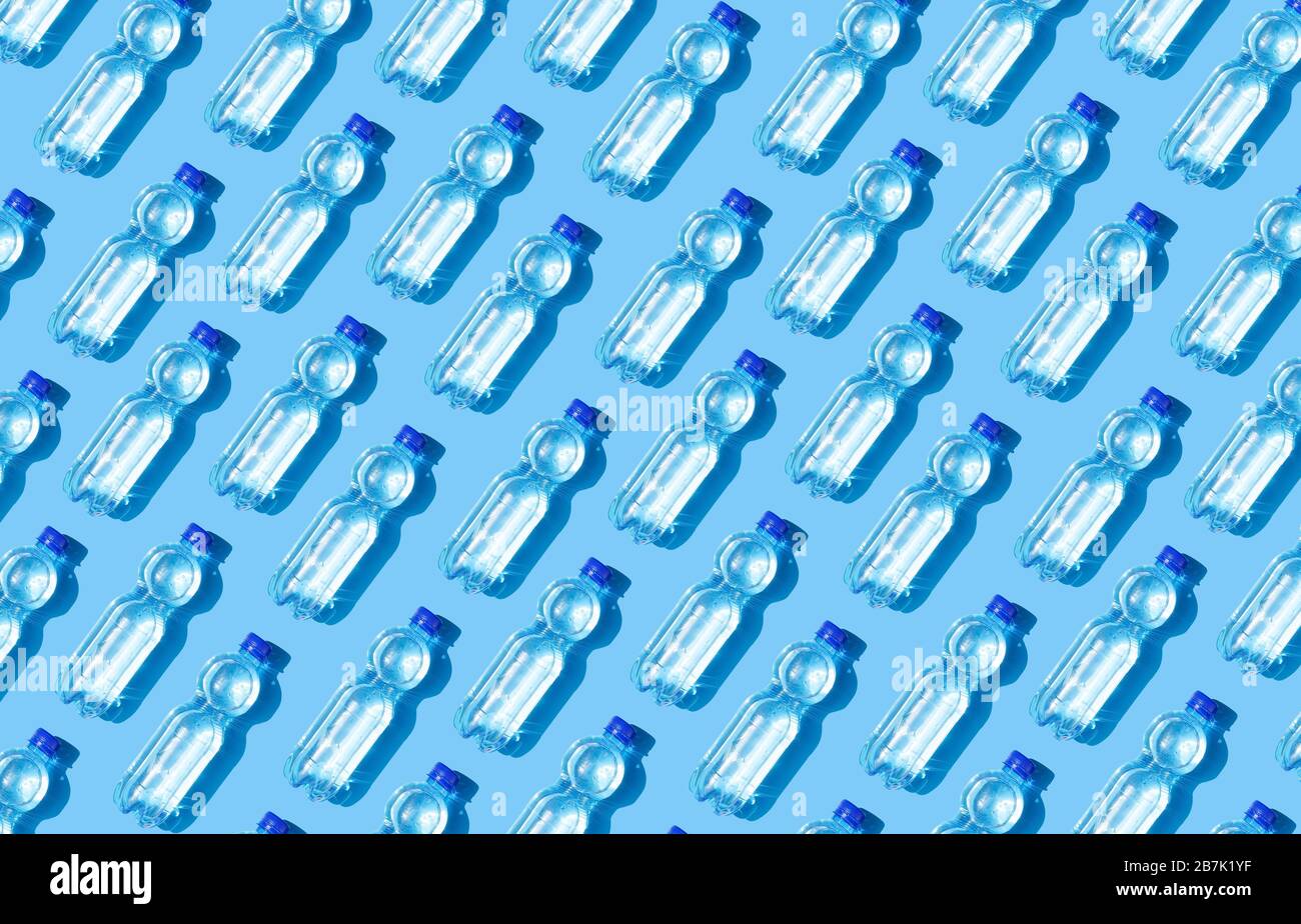 Mineral water bottles on blue background Stock Photo