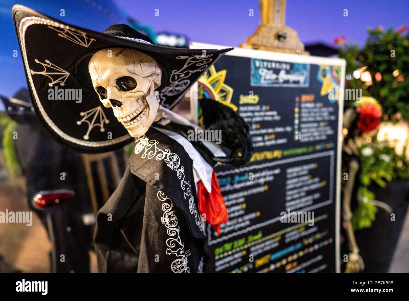 ALEXANDRIA, Virginia — Halloween decorations next to the menu board of a taco truck on the waterfront in Old Town, Alexandria, VA. Stock Photo