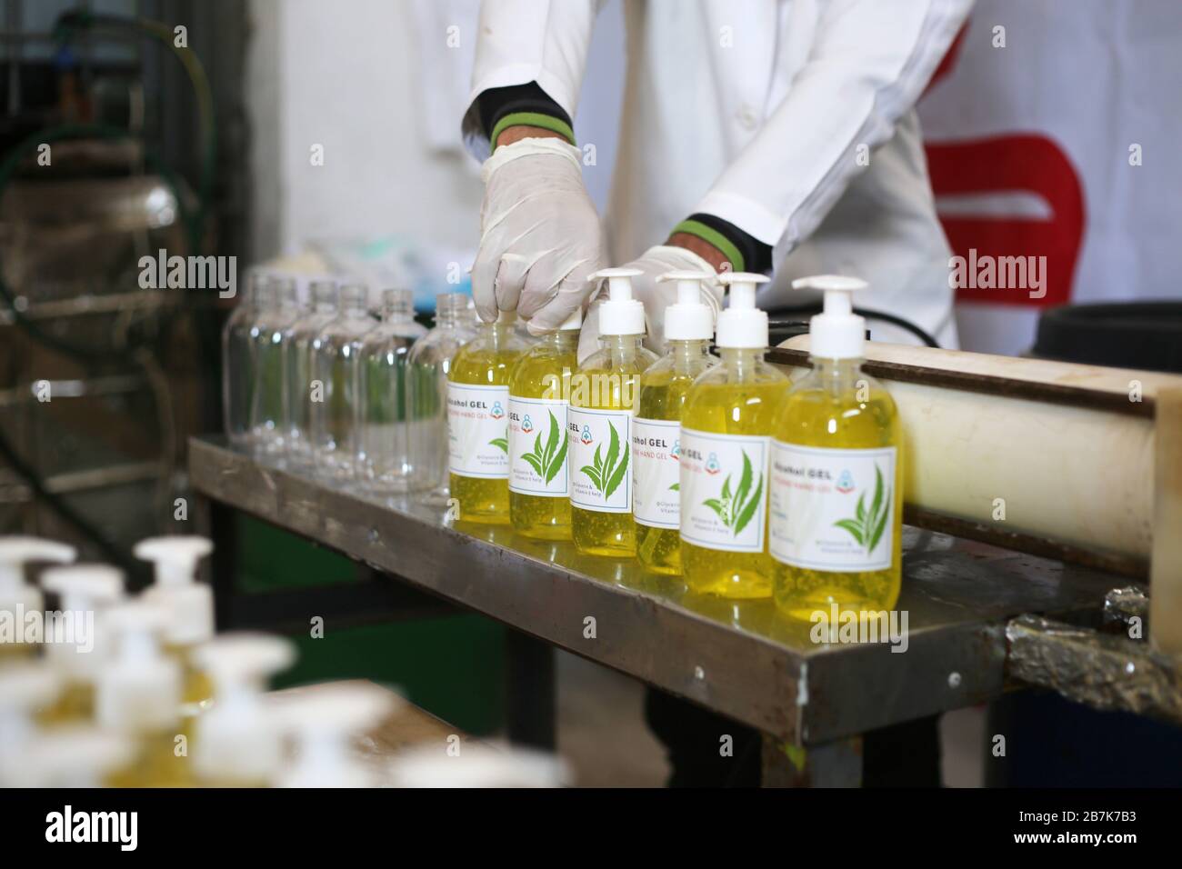 Gaza. 16th Mar, 2020. A Palestinian worker works on the production line of sterilizing gel at a cleaning materials factory in the southern Gaza Strip city of Rafah, March 16, 2020. Gaza authorities declared a new set of precautionary measures amid concerns about the spread of the novel coronavirus in the coastal enclave. Credit: Khaled Omar/Xinhua/Alamy Live News Stock Photo