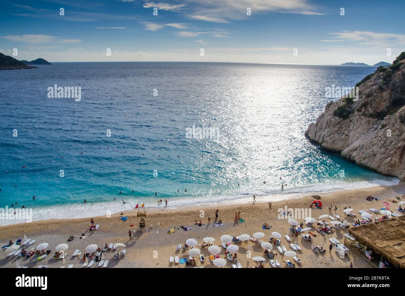 Antalya, Kas region,Turkey - September, 28, 2015: The famous Kaputas Beach. People entering the sea and the beach. Beach umbrellas and sunbeds. View Stock Photo