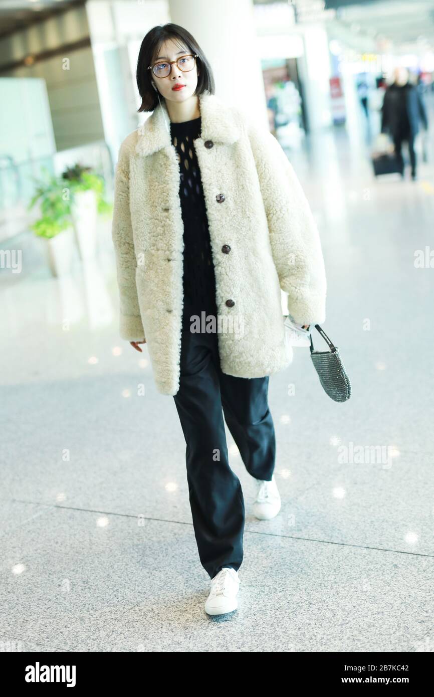 Chinese actress and singer Li Xirui arrives at Beijing airport before ...