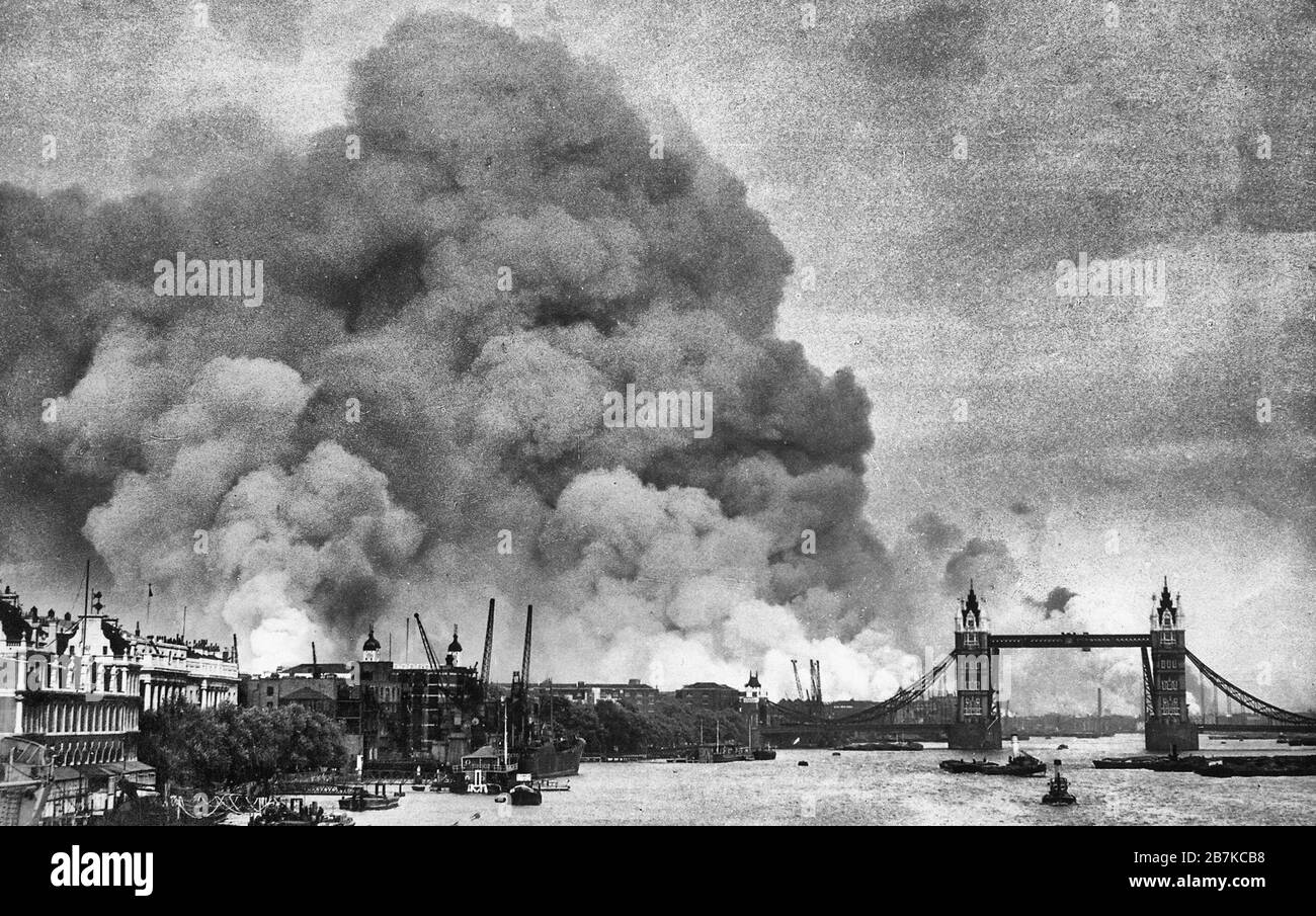 View along the River Thames in London towards smoke rising from the London docks after an air raid during the Blitz. 7 September 1940 Stock Photo