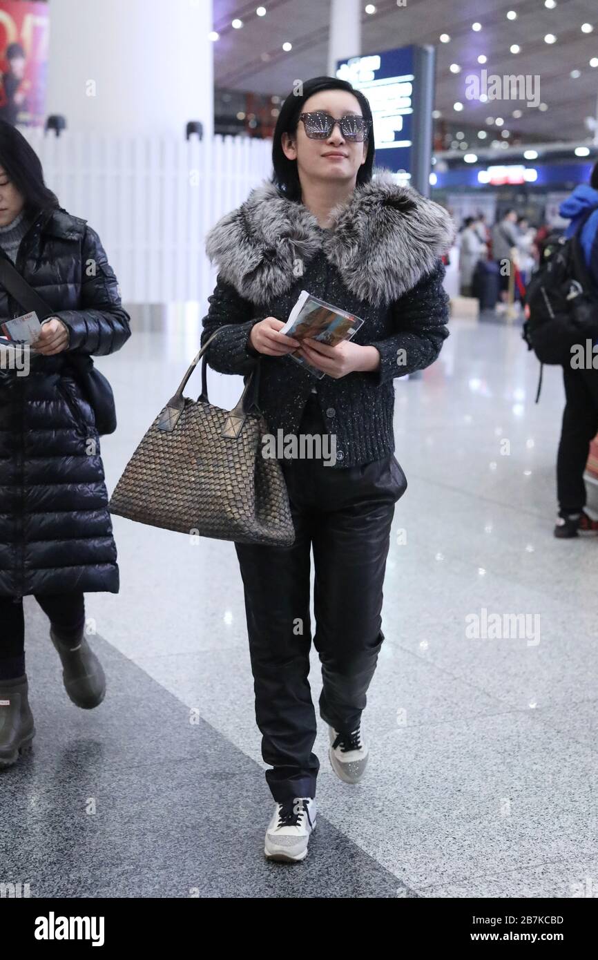 Chinese actress, screenwriter and singer Qin Hailu arrives at Beijing airport before departure in Beijing, China, 20 January 2020. Stock Photo