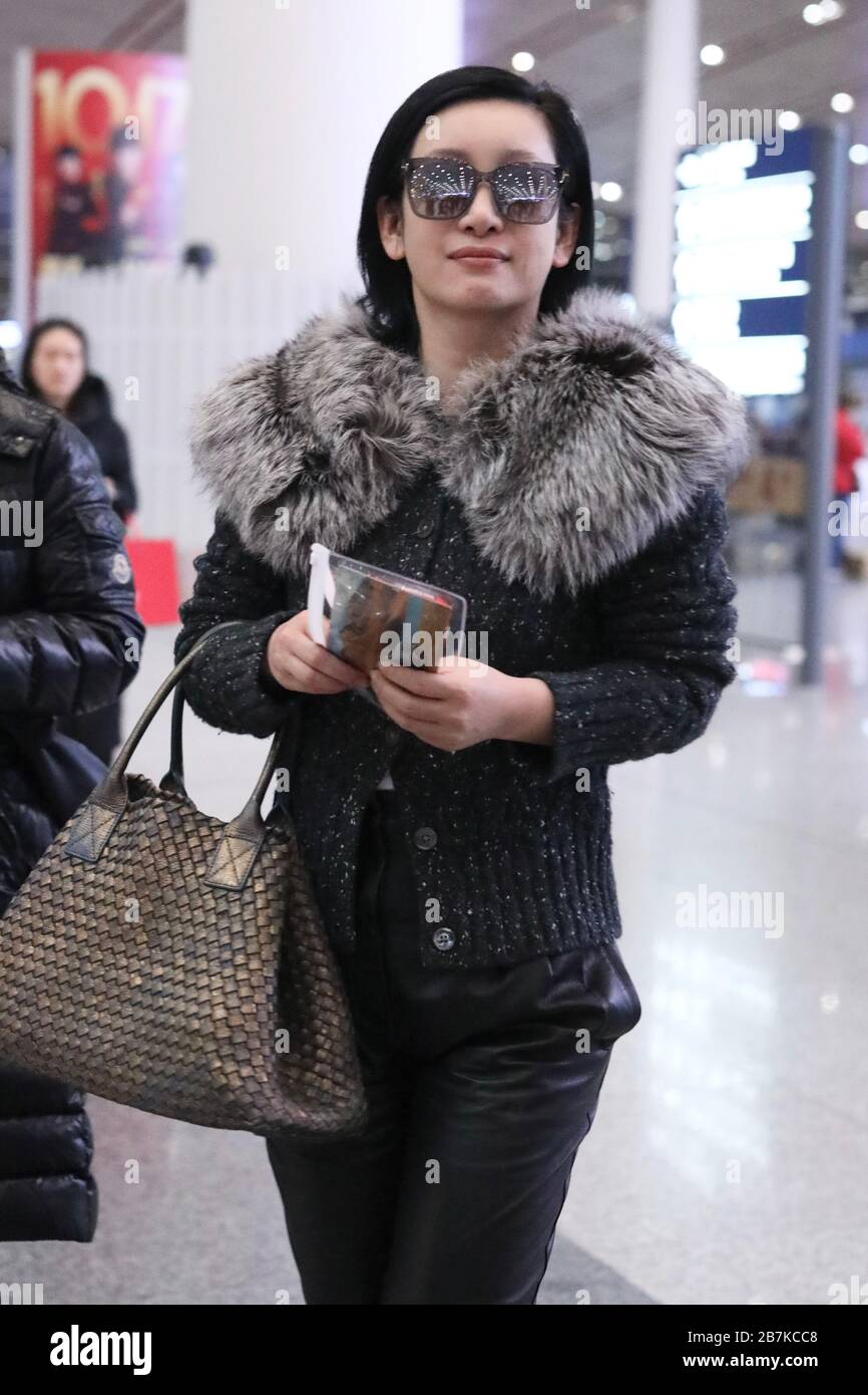 Chinese actress, screenwriter and singer Qin Hailu arrives at Beijing airport before departure in Beijing, China, 20 January 2020. Stock Photo
