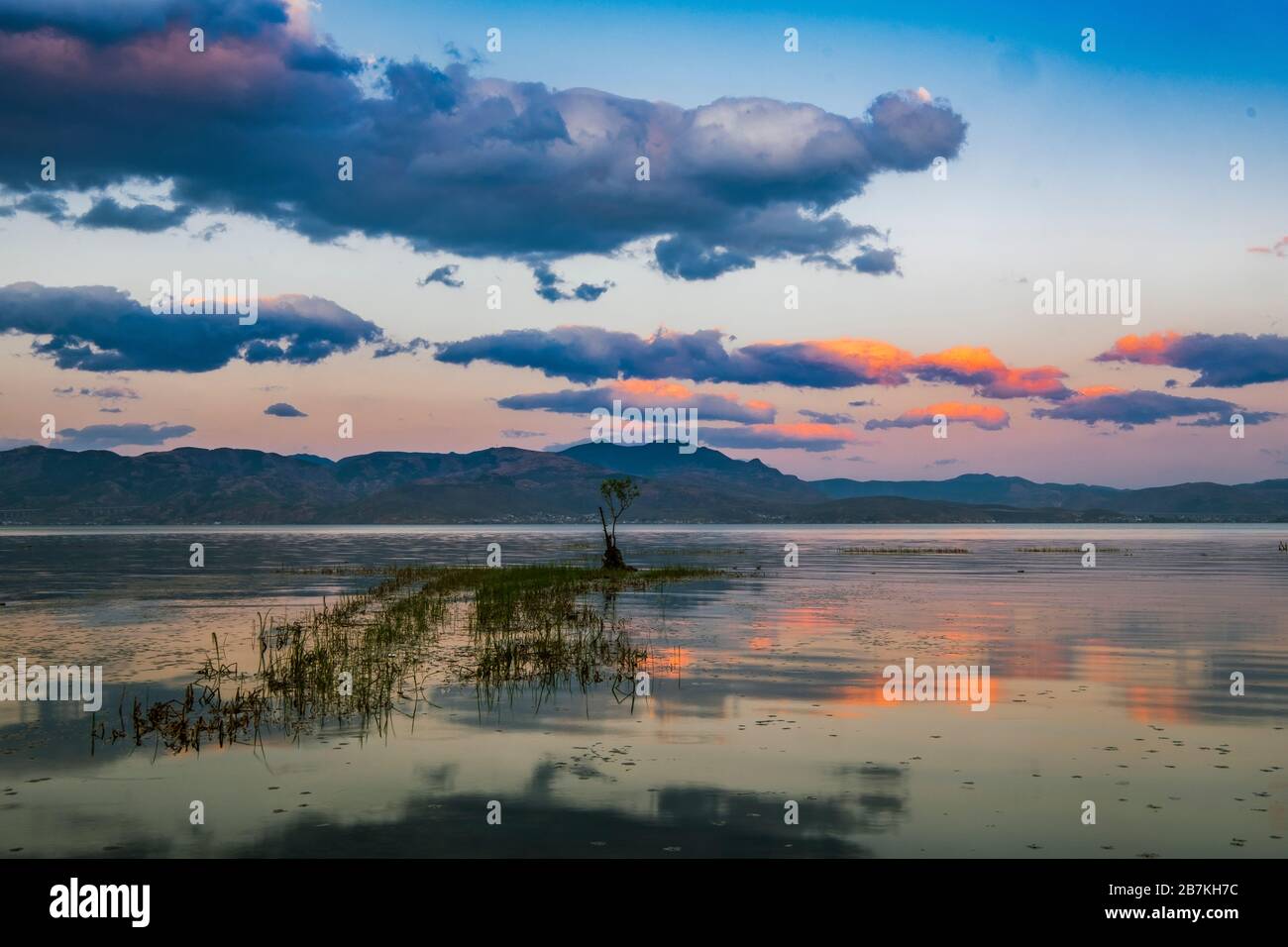 --FILE--The view of sky and sceneries reflected on Erhai, also known as Er Lake, a popular tourist attraction, Dali city, southwest China's Yunnan pro Stock Photo