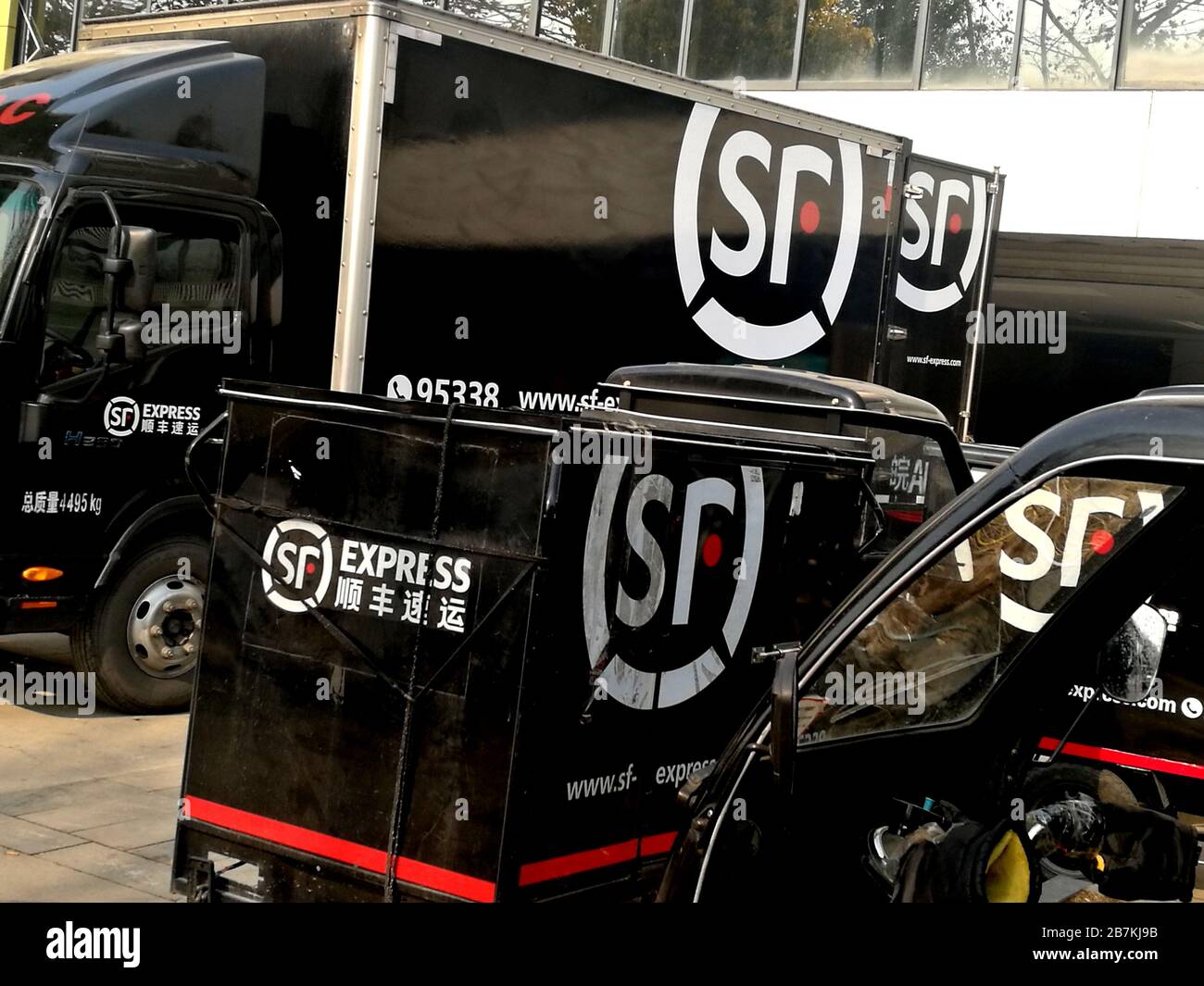 In this unlocated photo, several delivery trucks on which there are