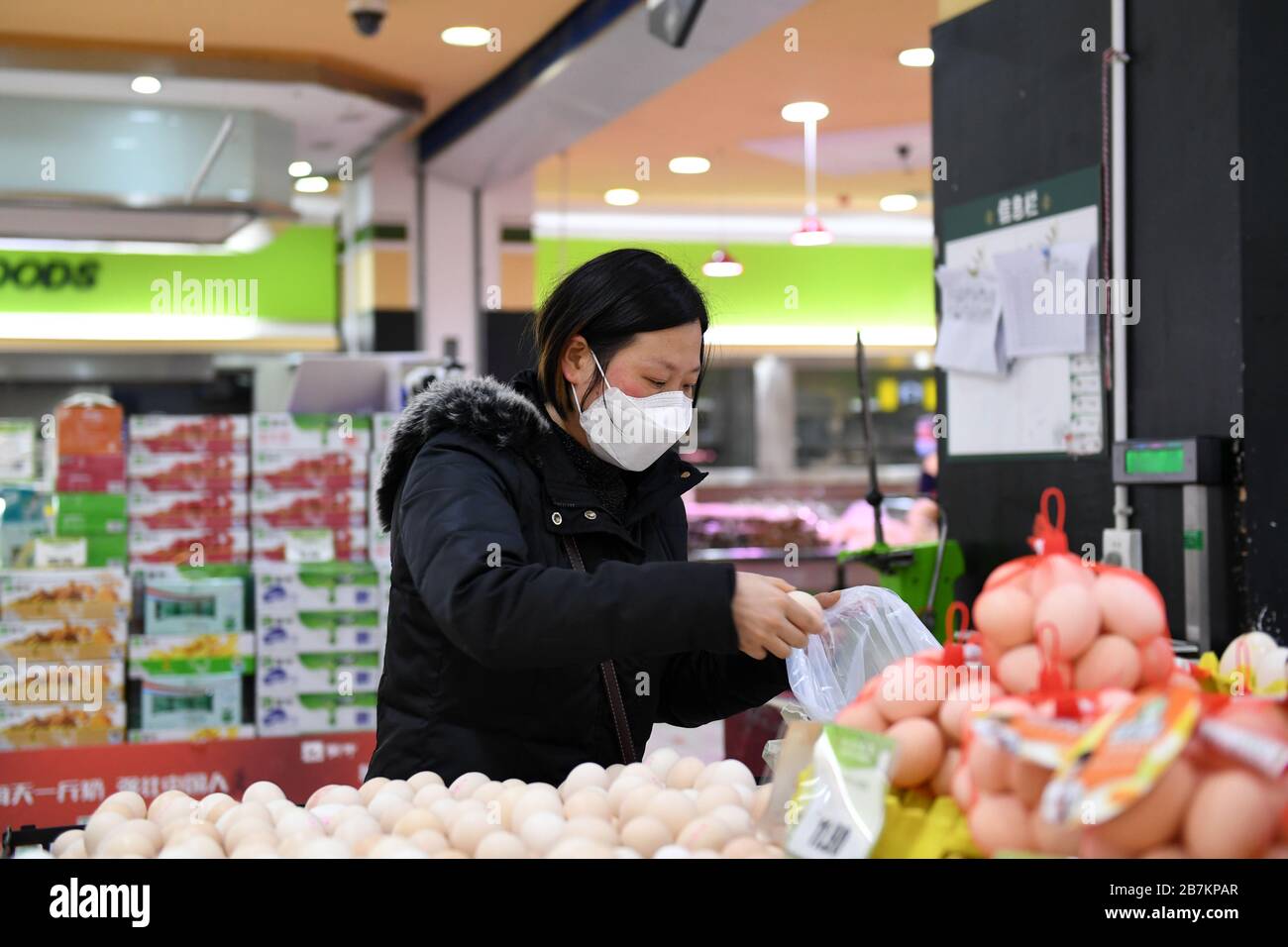 A person shops for eggs in a supermarket in Huairen city, northwest China's Guizhou province, 23 February 2020. Stock Photo