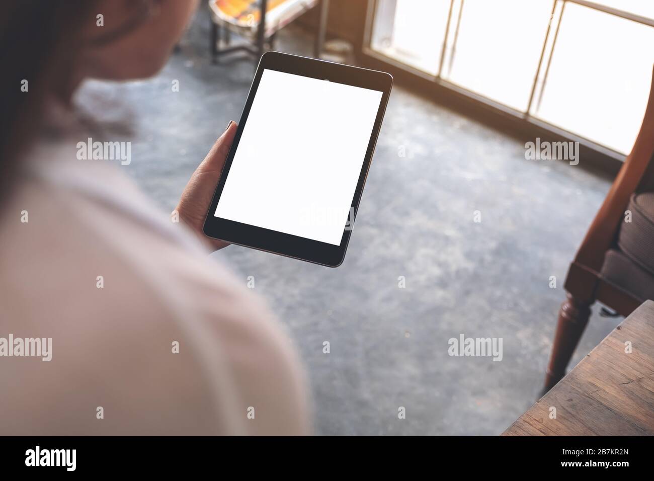 Mockup image of woman's hands holding black tablet pc with white blank ...