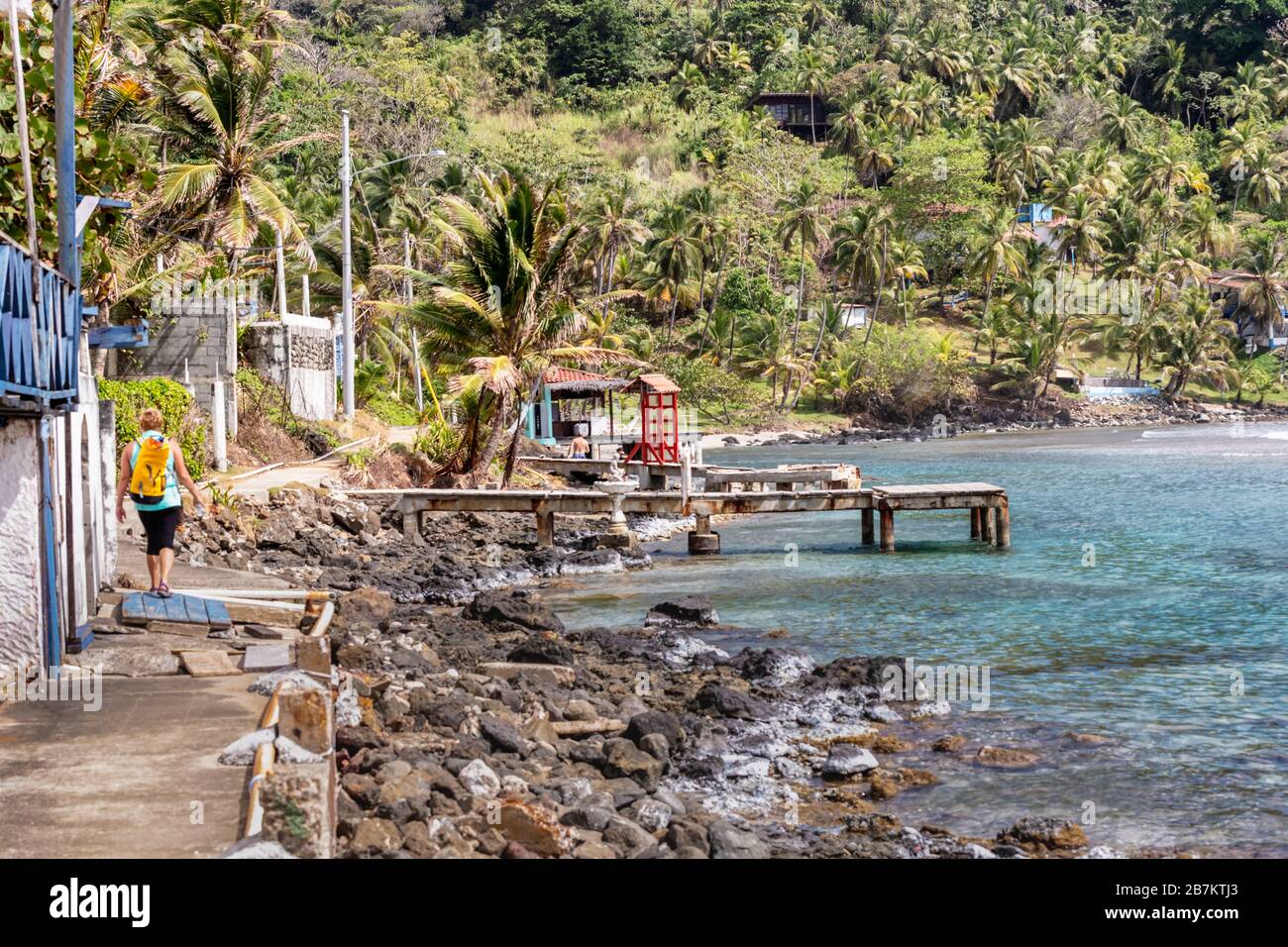 View at Palm trees, sea and houses in Isla Grande shore. Colon province, Panama, Caribbean, Central America. Stock Photo
