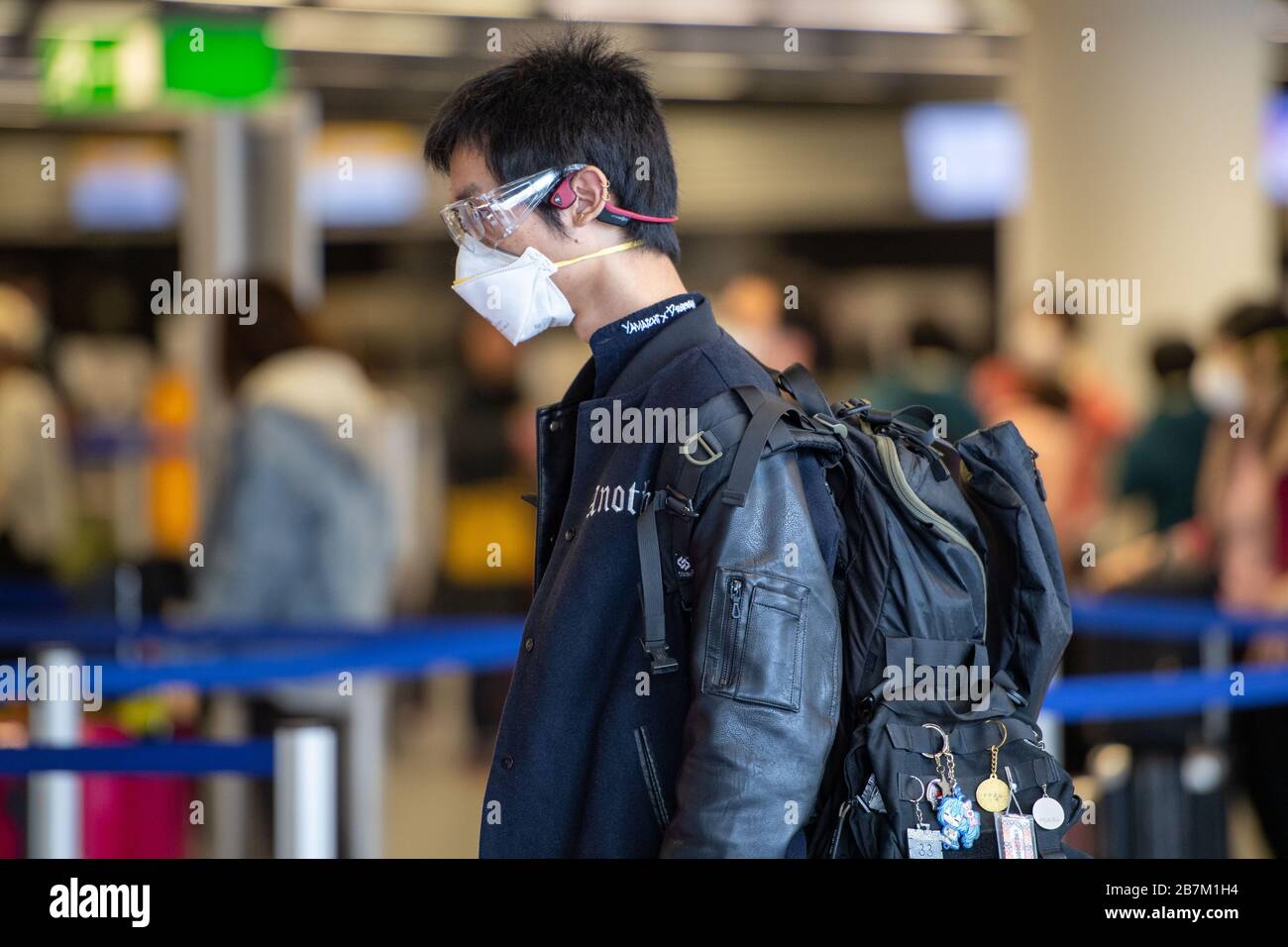 A passenger with face mask, half figure, half figure, Frankfurt Airport, ticket halls, on March