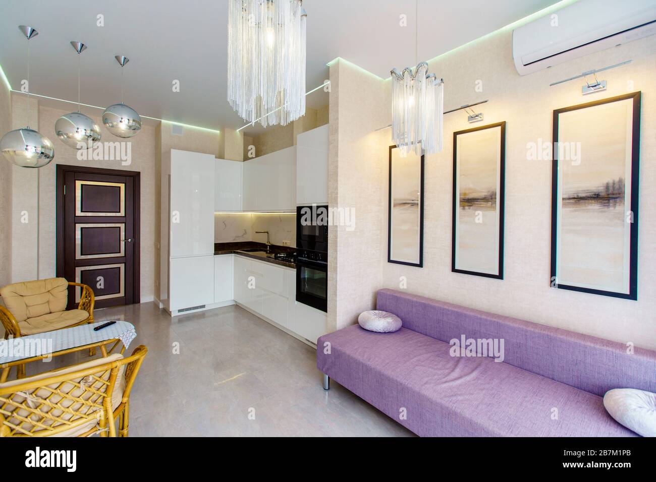Kitchen room with a fresh renovation in beige tones. White kitchen set