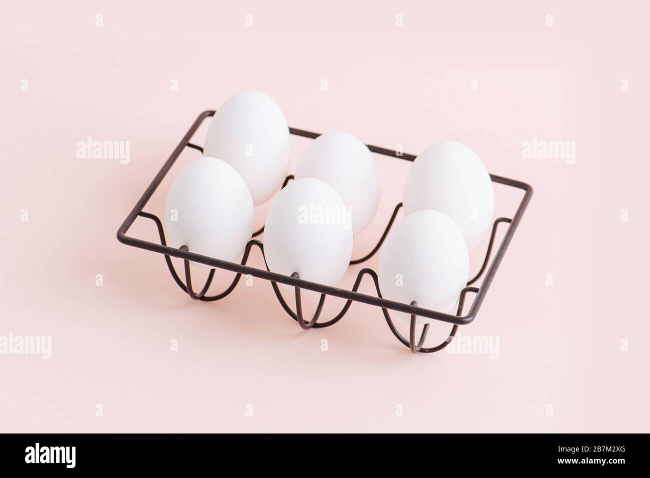 White eggs in a beautiful black stand Stock Photo