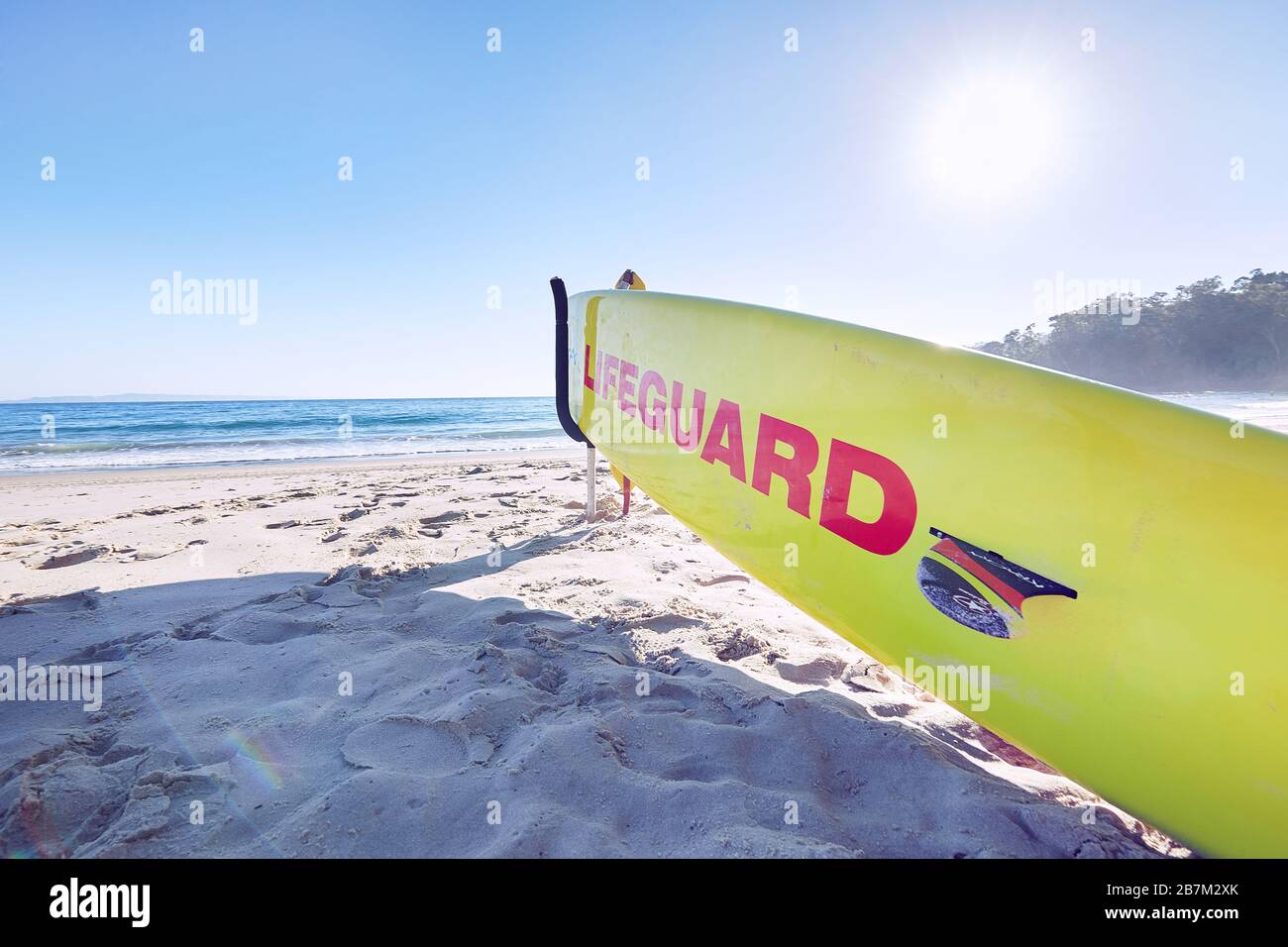 Lifeguard equipment in early morning light on a deserted Main Beach at Noosa, Queensland, Australia Stock Photo