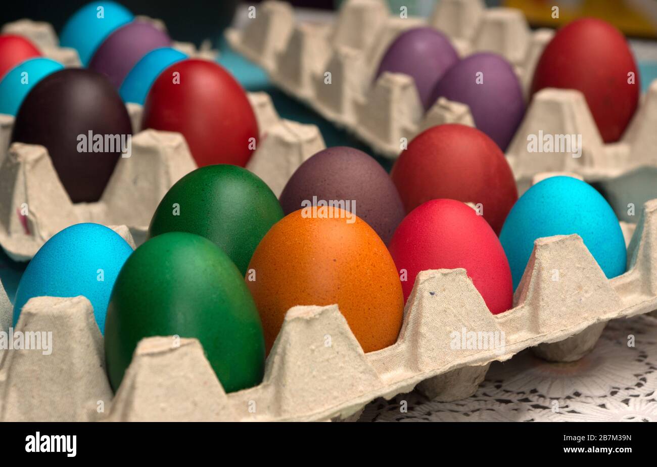 Multicolored painted Easter eggs in cardboard container Stock Photo