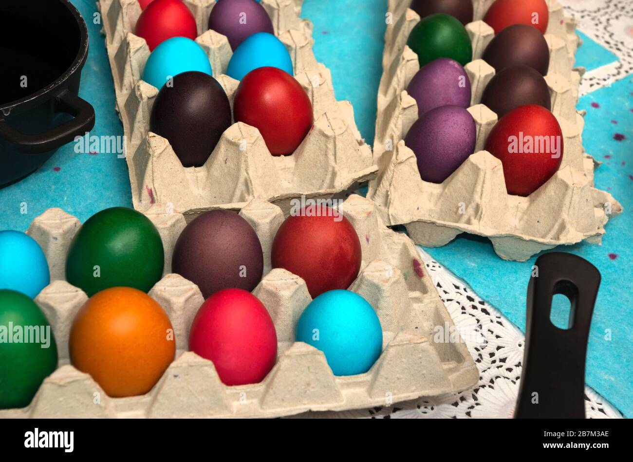 Multicolored painted Easter eggs in cardboard container Stock Photo