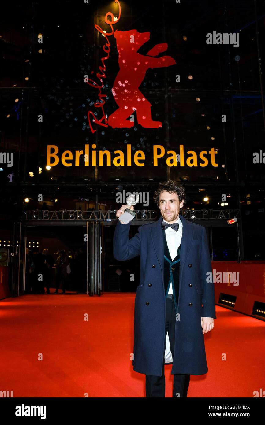 Elio Germano poses with their award Silver Bear for Best Actor  on the Red Carpet at the Closing Ceremony and Awards for the 70th Berlin International Film Festival ( Berlinale ) on Saturday 29 February 2020 at Berlinale Palast, Potsdamer Platz, Berlin. . Picture by Julie Edwards. Stock Photo