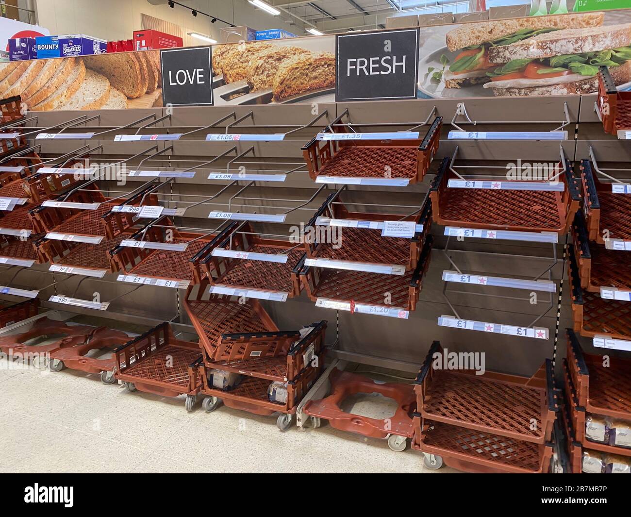 OXFORD, UK - March 16th 2020: Empty supermarket shelves at a local grocery store as people prepare for coronavirus lockdown Stock Photo