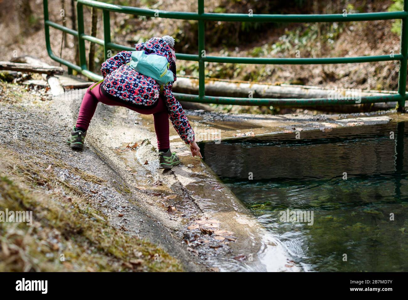 Children hiking in mountains or forest with sport hiking clothes. Girls are  playing and learning in the nature with cold lake water and winter clothin  Stock Photo - Alamy