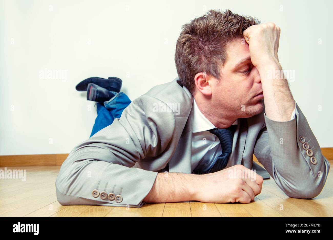 Person lying on floor hi-res stock photography and images - Alamy