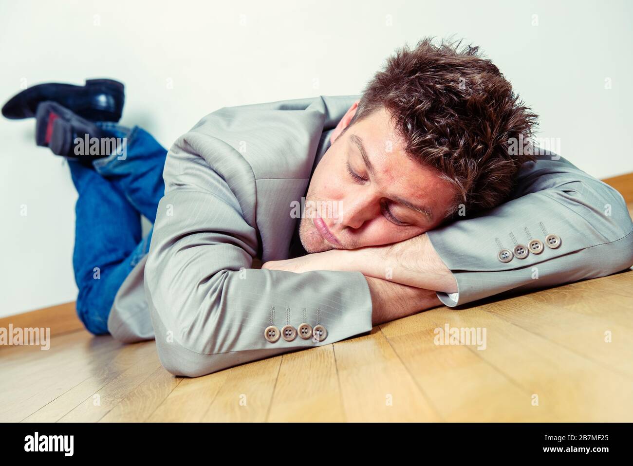 Person lying on floor hi-res stock photography and images - Alamy