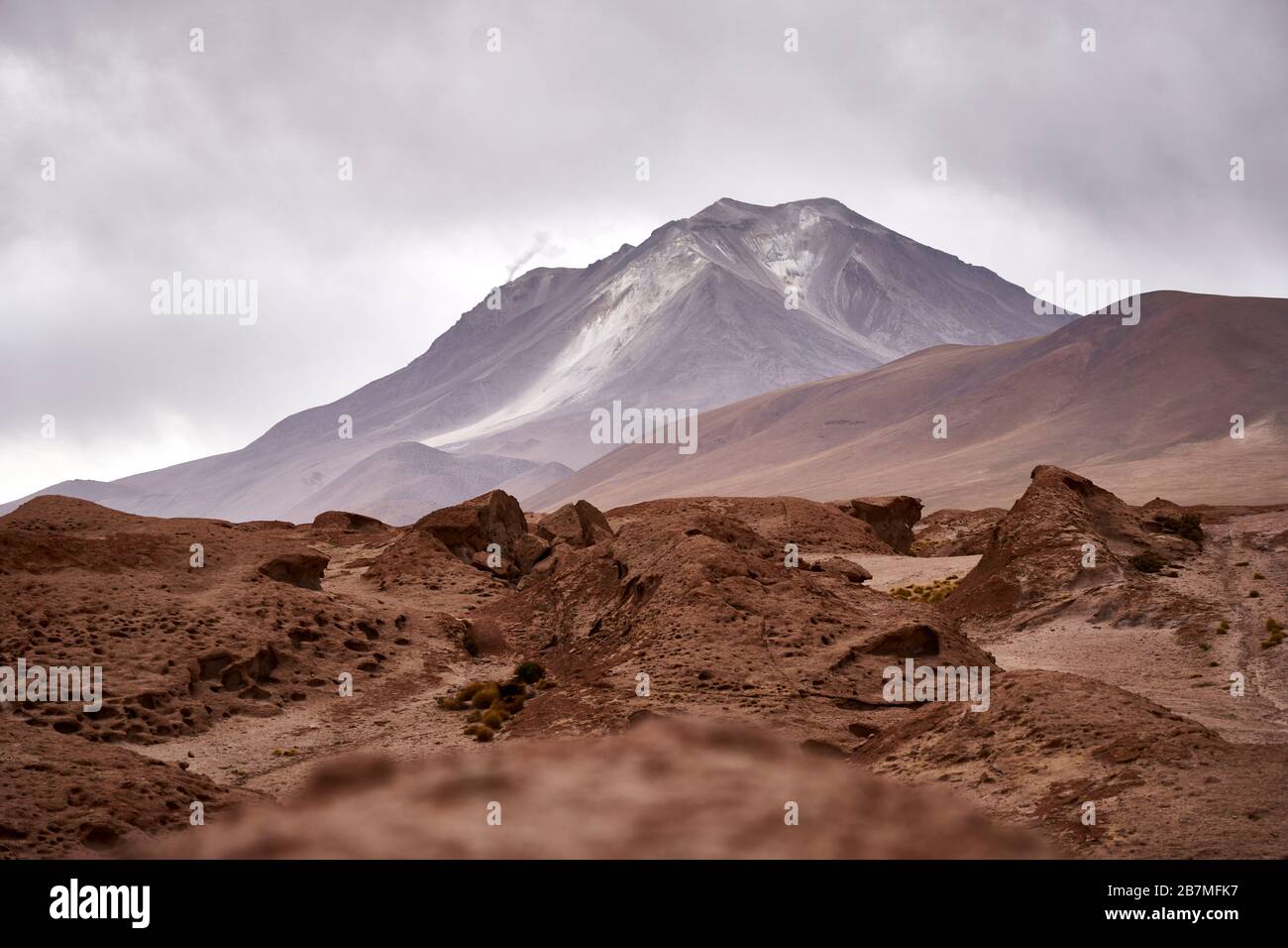 Smoking volcano on the Altiplano Andean Plateau in Bolivia Stock Photo