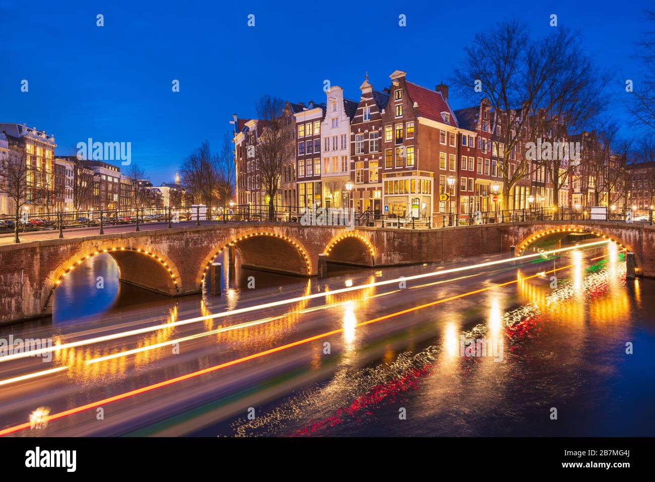 Amsterdam, Netherlands bridges and canals at twilight. Stock Photo