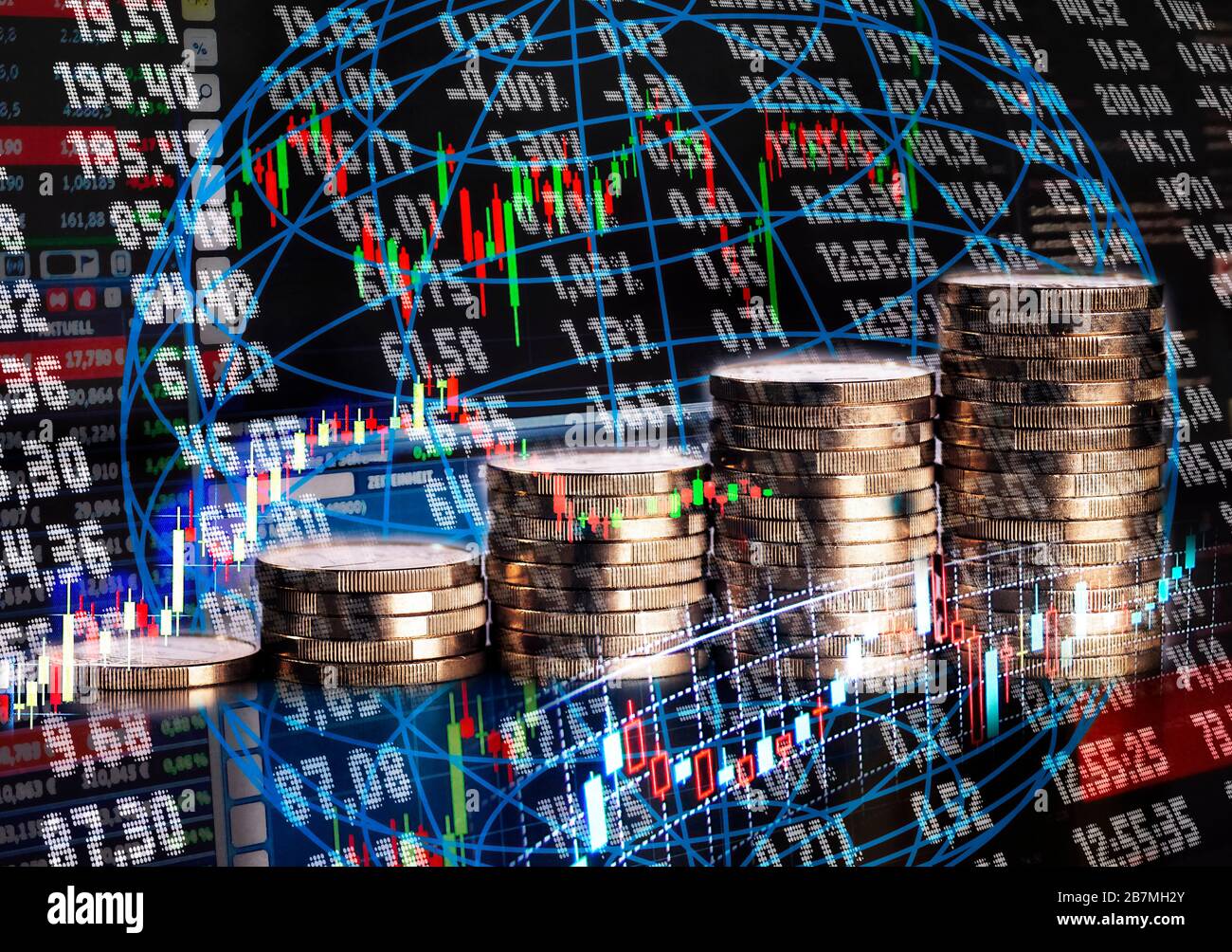Stack of coins in front of a board and graphics with exchange rates Stock Photo