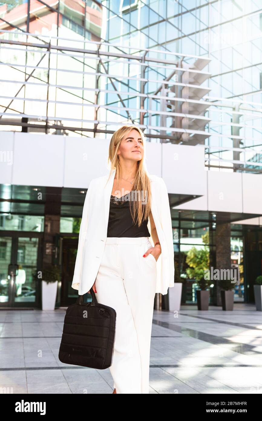 Woman in white suit hi-res stock photography and images - Alamy