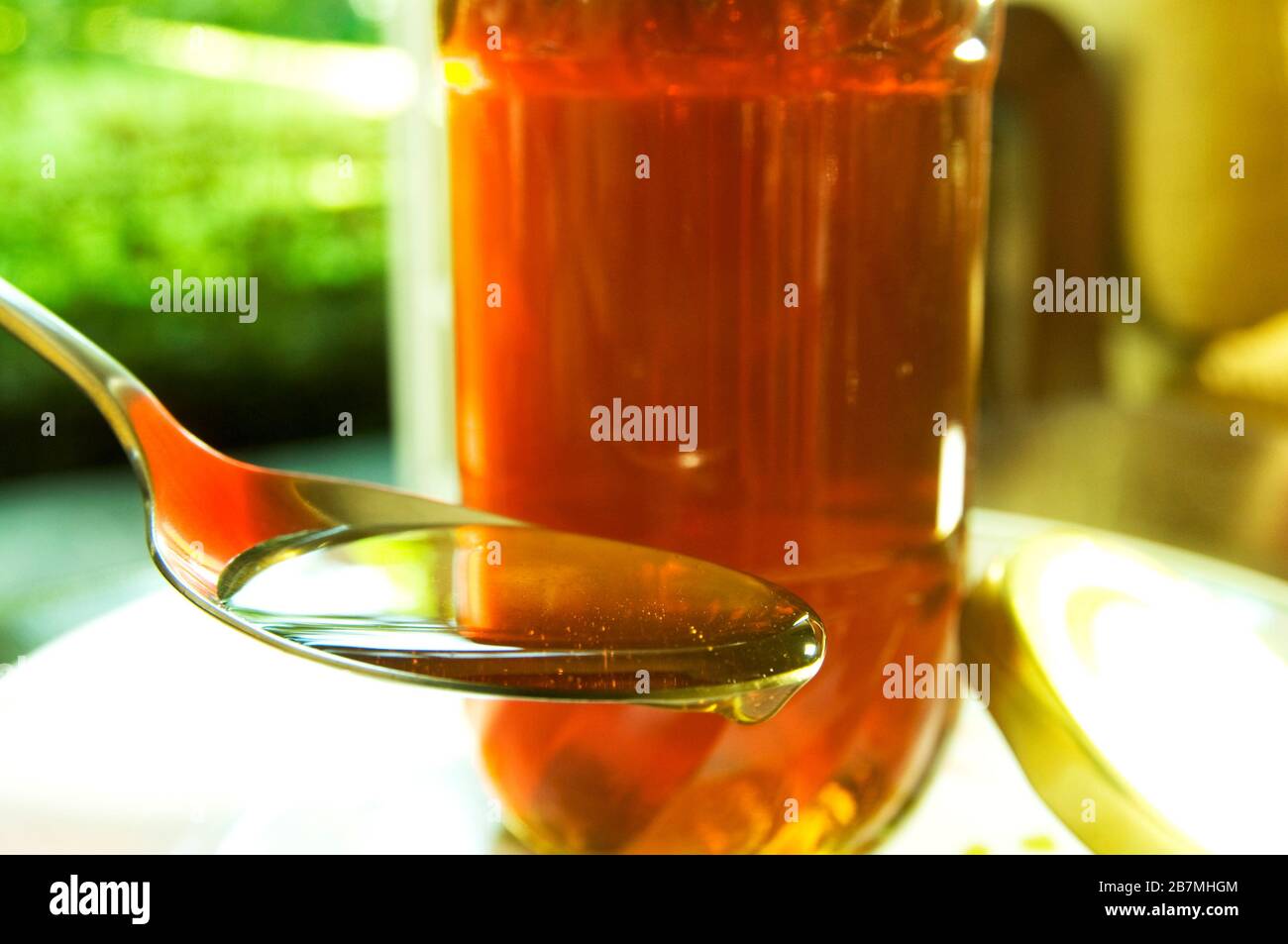 Honey is a sweet, viscous food made by honey bees. It is both healthy and delicious. Stock Photo