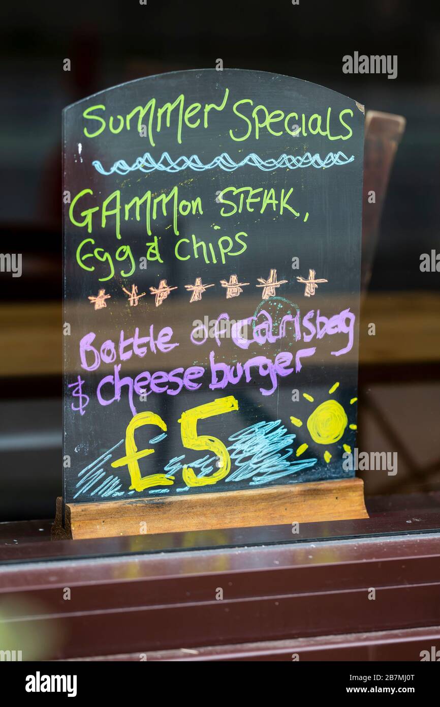 A food and drink sign in a pub window in Glasgow city centre, Scotland, UK Stock Photo