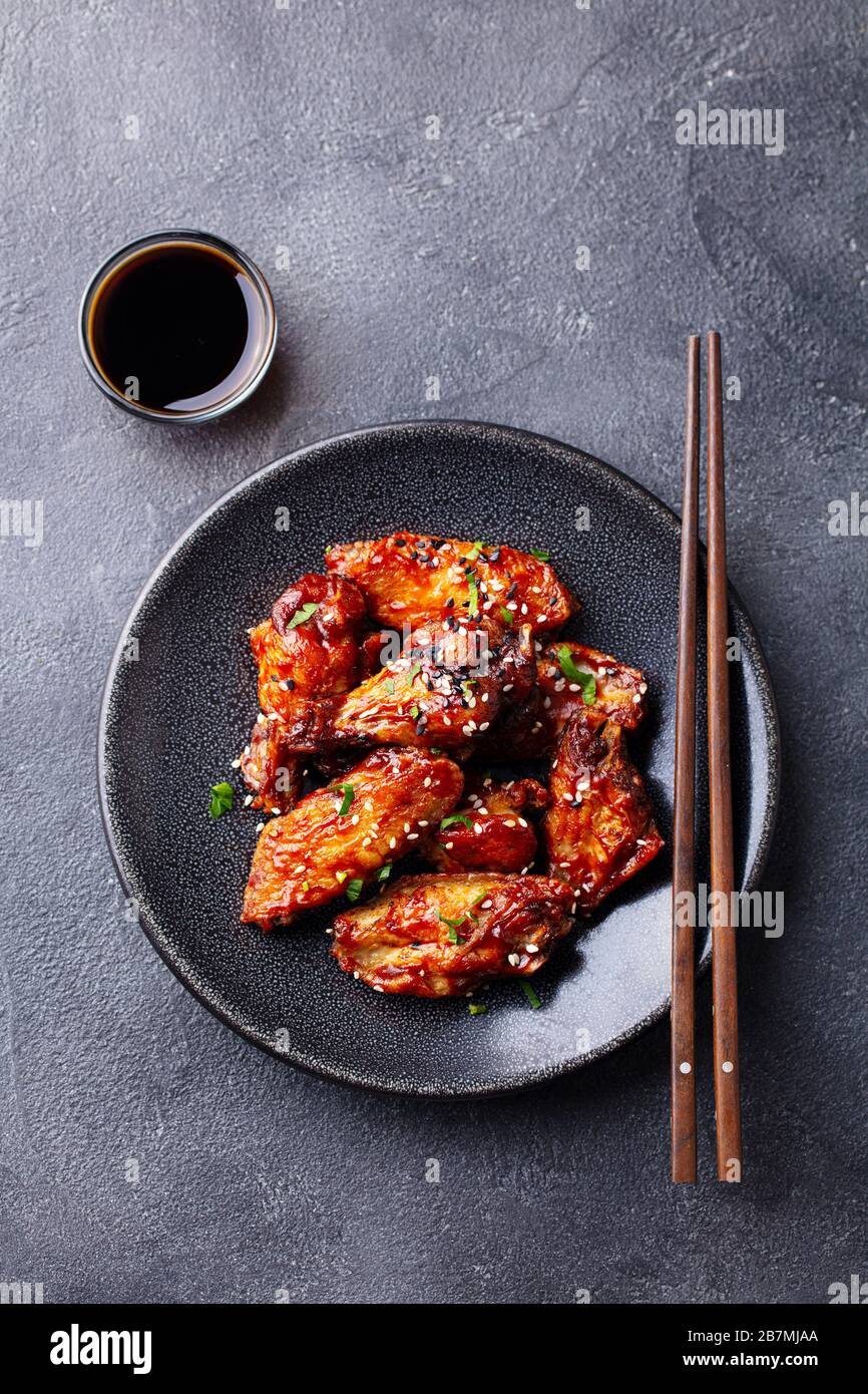 Chicken wings. Traditional asian recipe. Dark background. Copy space. Top view. Stock Photo