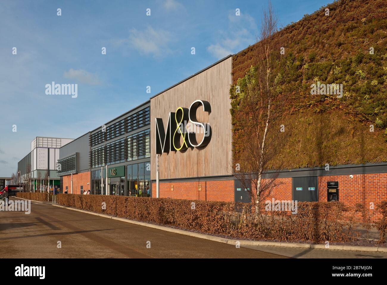 M&S Shop Stores and Vertical Garden with Plant and Greenery Living Wall at the Vanguard Retail Park Shopping Centre York North Yorkshire England UK Stock Photo