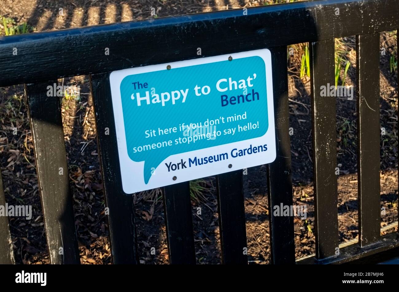 ‘Happy to chat’ bench to encourage social interaction Museum Gardens York North Yorkshire England UK United Kingdom GB Great Britain Stock Photo