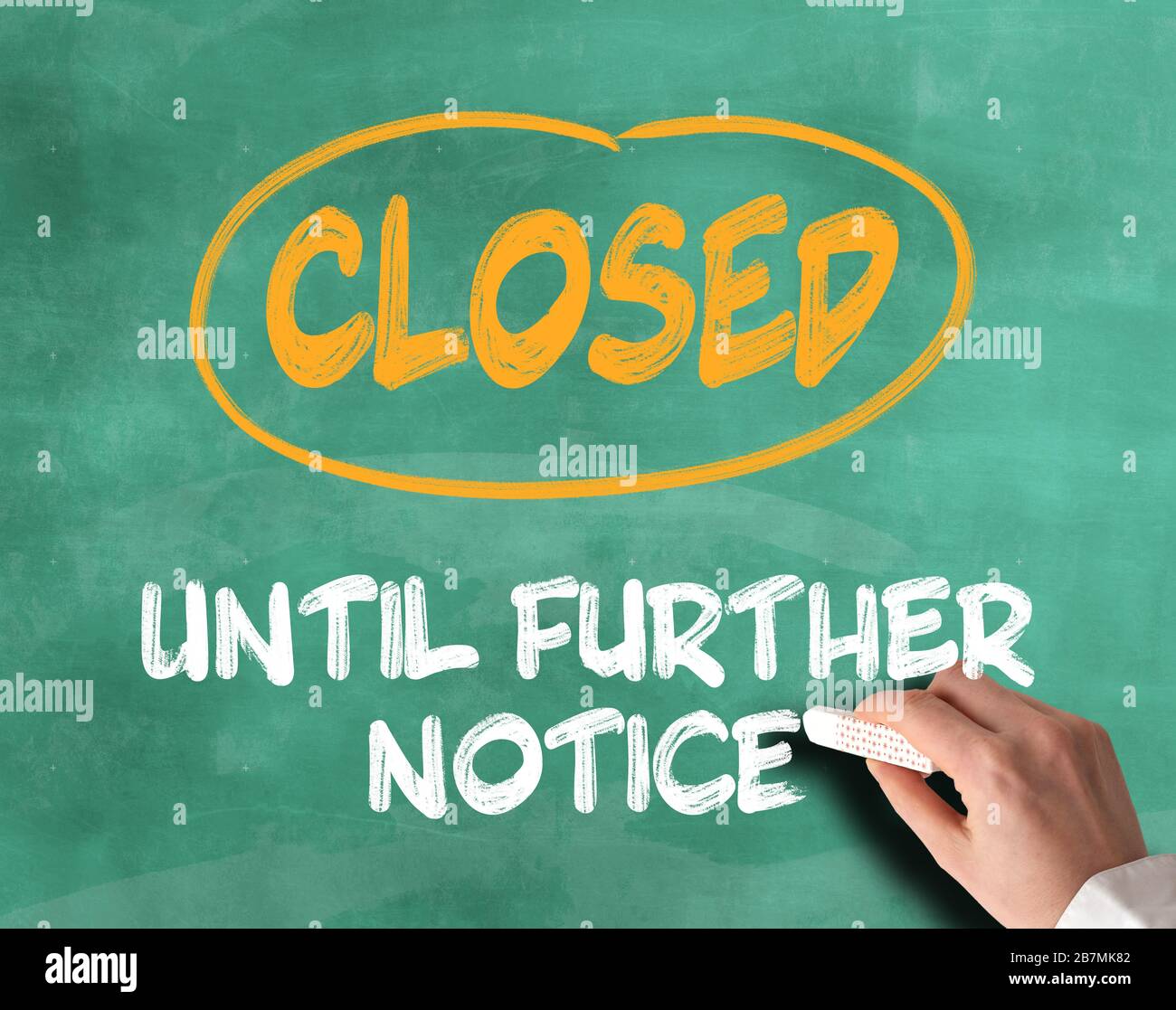 text CLOSED UNTIL FURTHER NOTICE on chalkboard, schools and shops and retail stores closed during corona outbreak concept Stock Photo